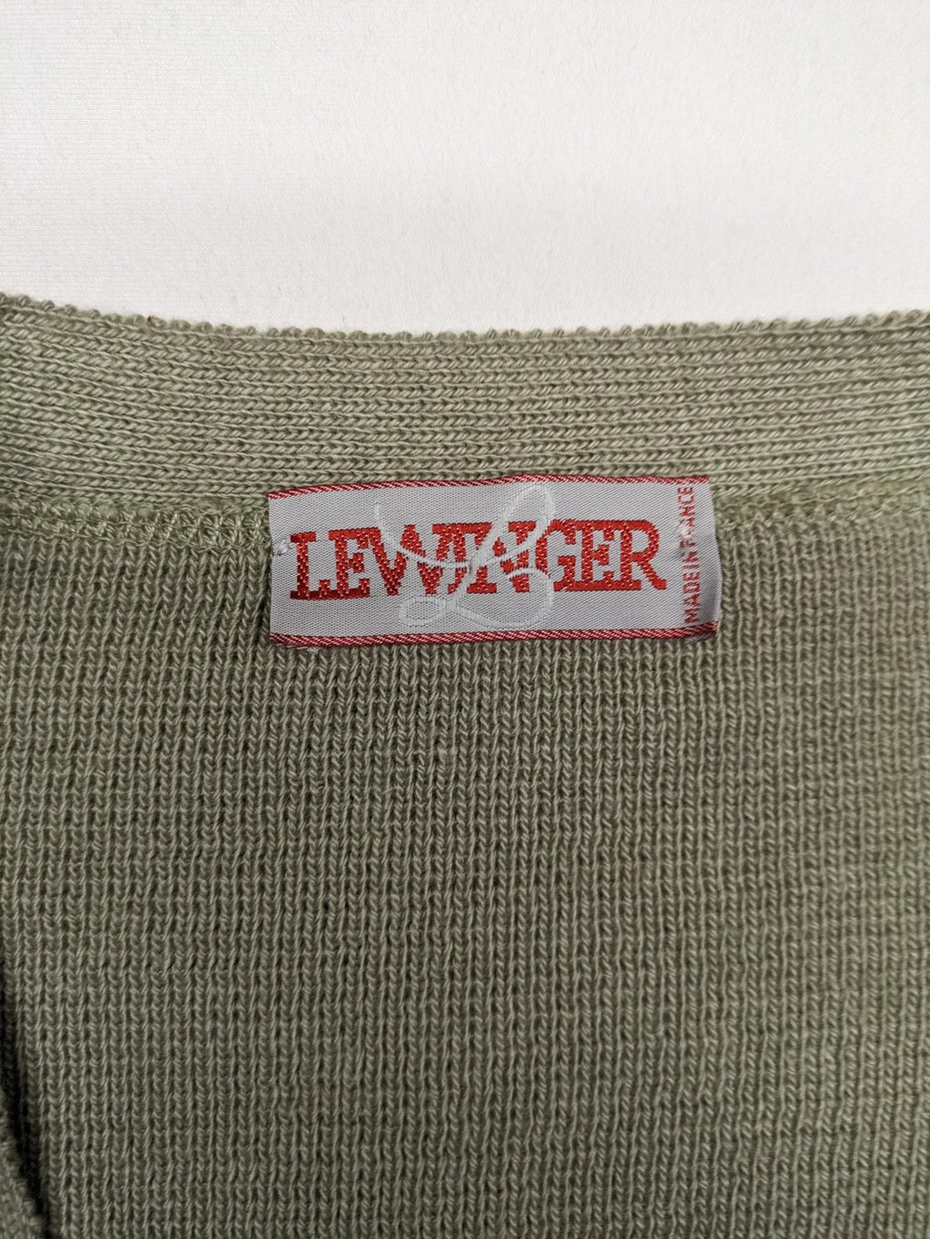 Lewträger cream and grey turtle neck jumper with geometric pattern and button placket.