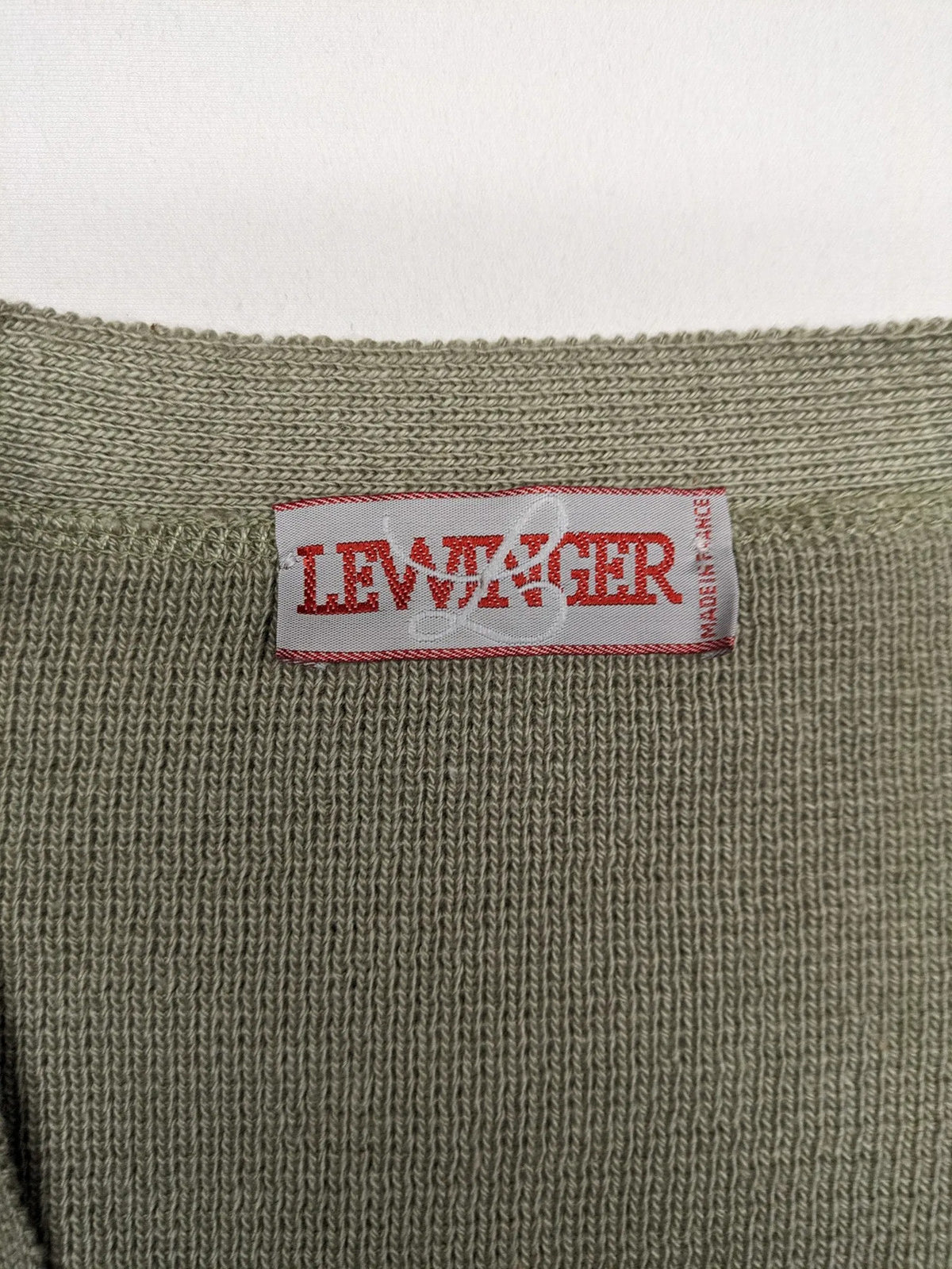 Lewträger cream and grey turtle neck jumper with geometric pattern and button placket.