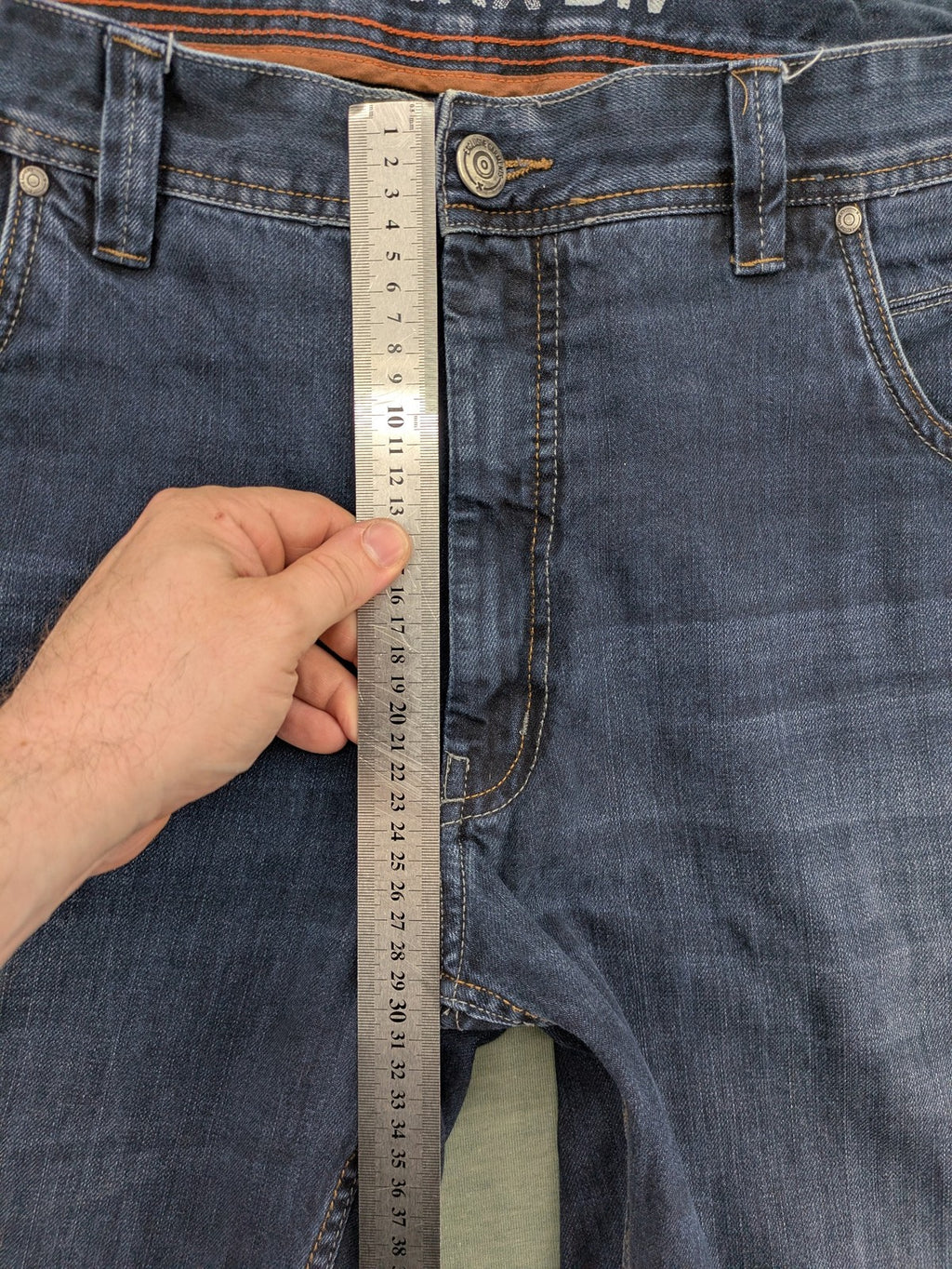 Canda blue straight jeans with five-pocket design and dark wash denim.