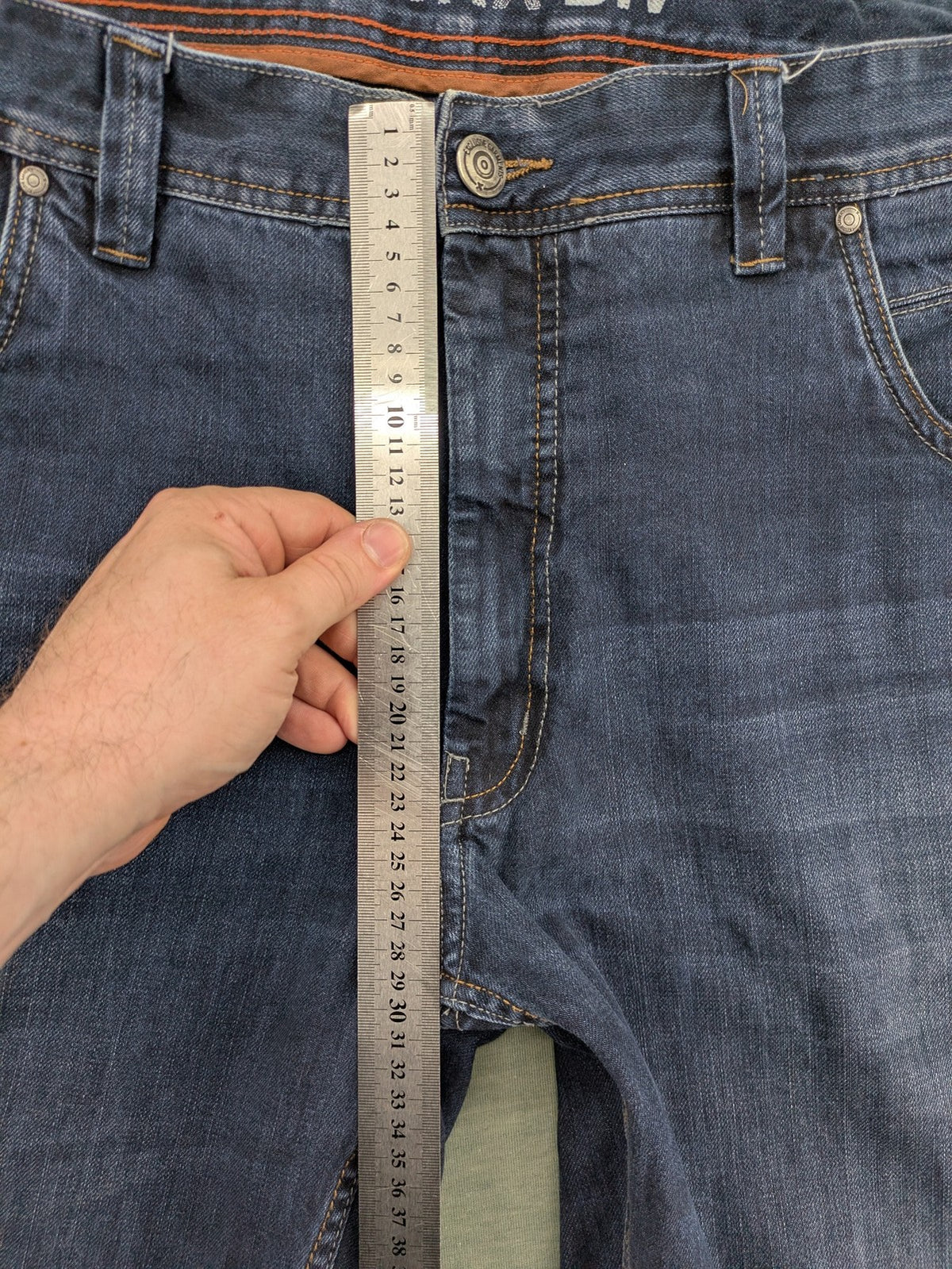 Canda blue straight jeans with five-pocket design and dark wash denim.