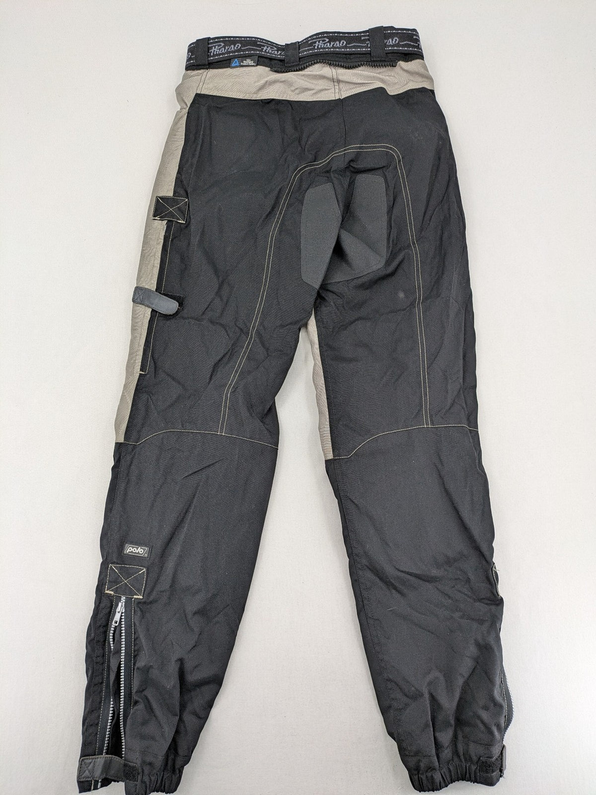 Pharao cream chaps with integrated knee protectors and adjustable waist belt.