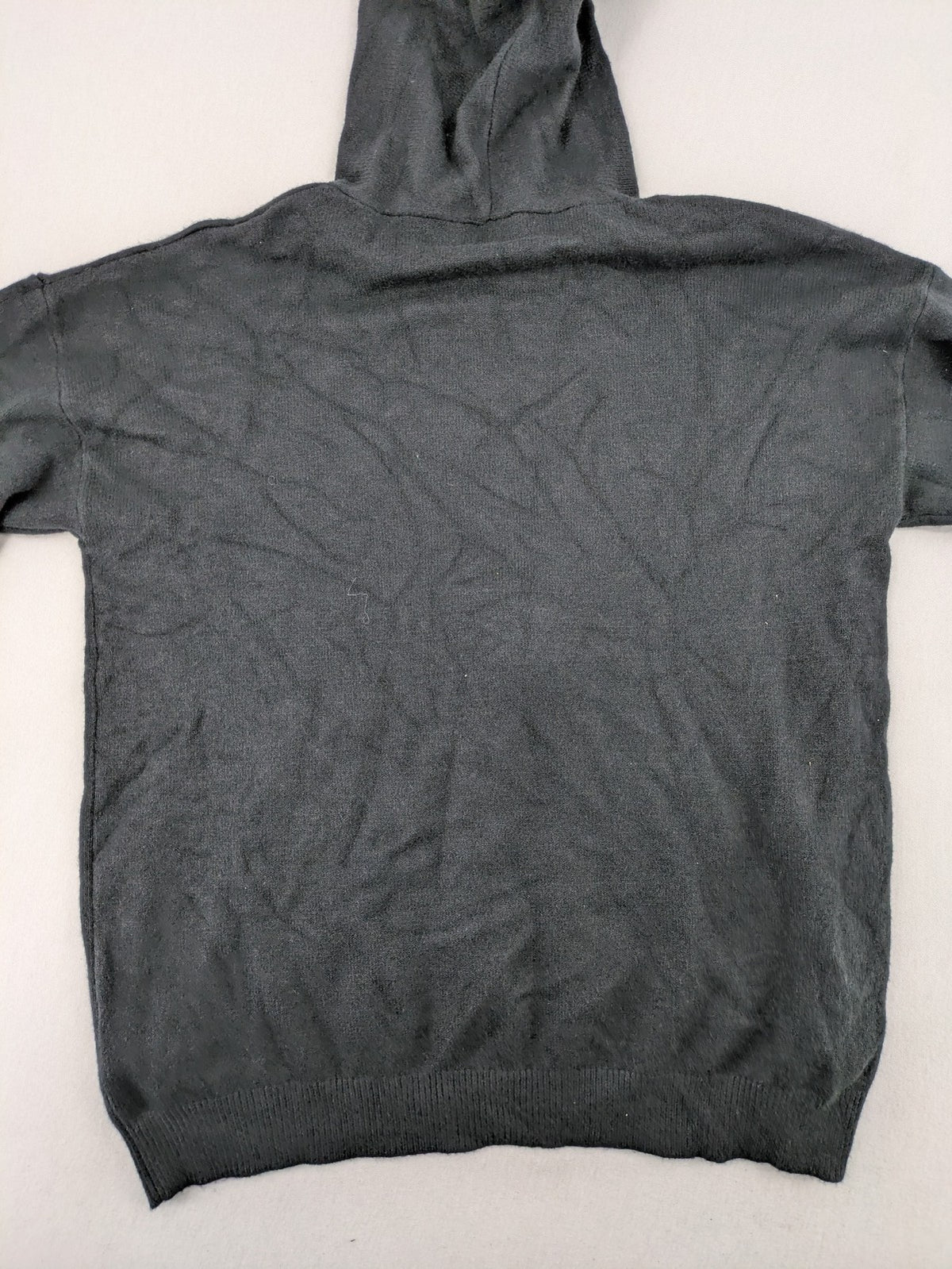 M/L grey hoodie with playful pom-poms and soft viscose blend material.