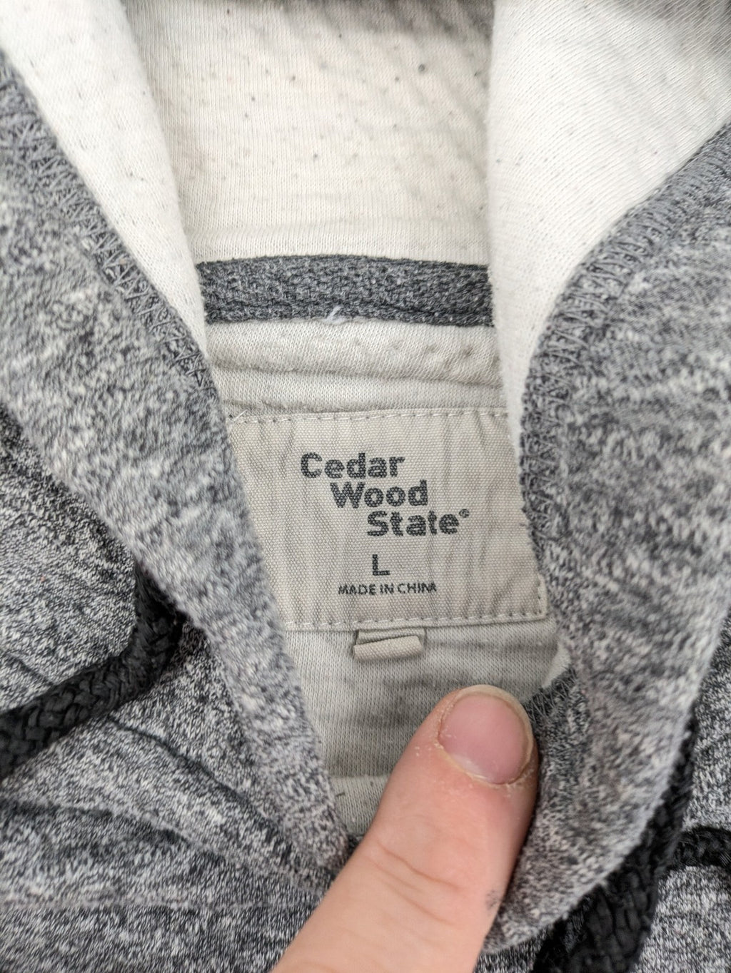 Cedarwood State grey pullover hoodie with adjustable drawstring hood and kangaroo pocket.