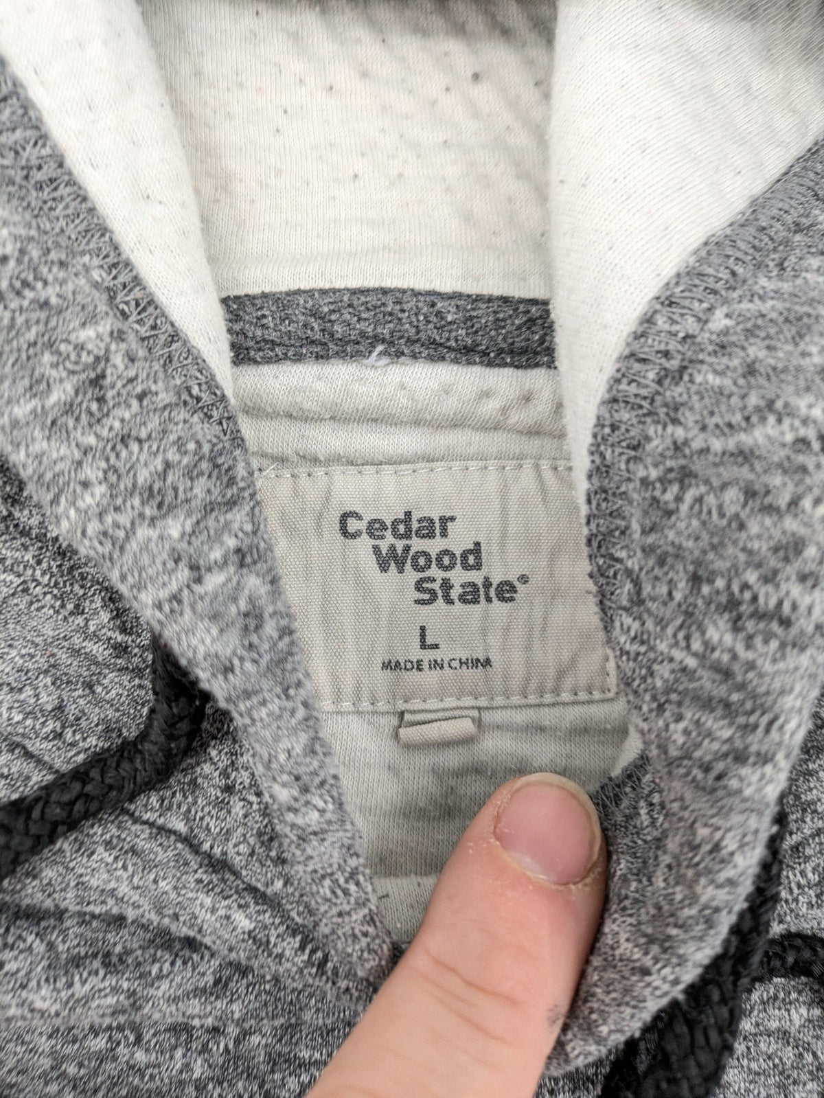 Cedarwood State grey pullover hoodie with adjustable drawstring hood and kangaroo pocket.