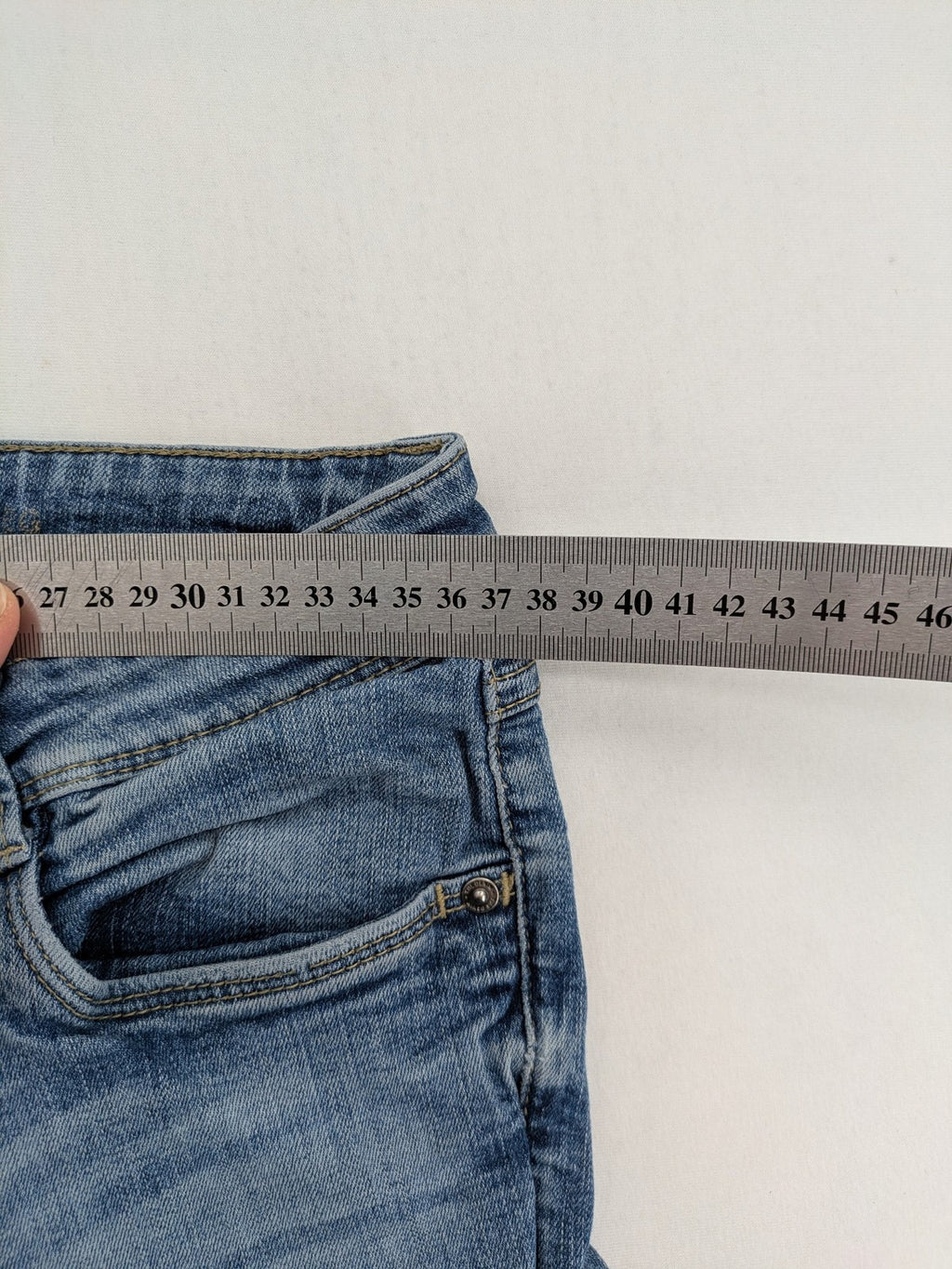 C&A blue bootcut jeans with faded denim and low rise fit, made from cotton blend.
