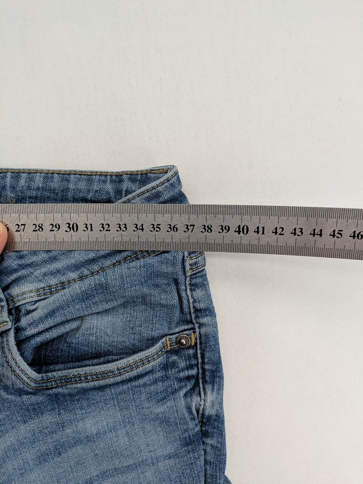 C&A blue bootcut jeans with faded denim and low rise fit, made from cotton blend.