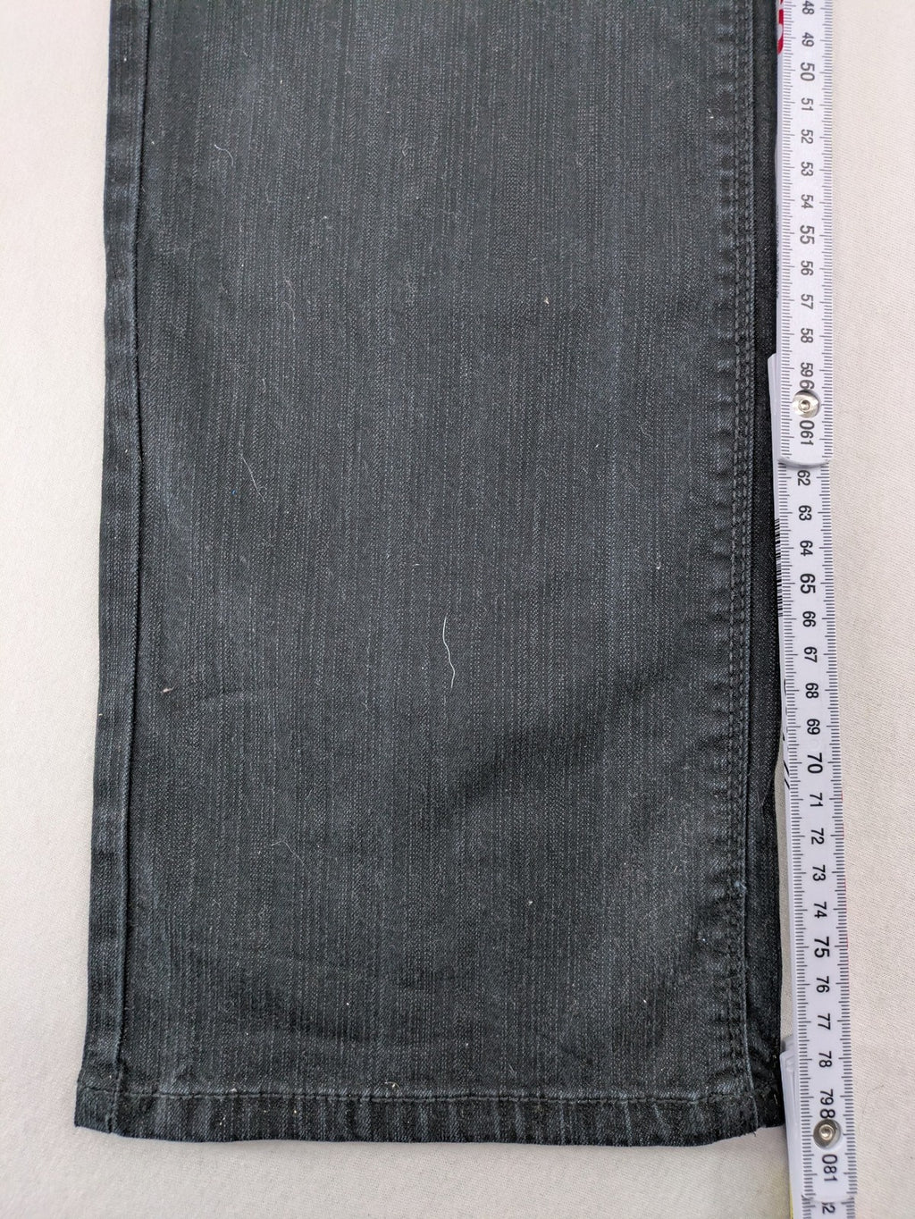 Yessica black straight jeans with classic dark wash and stretch denim material.