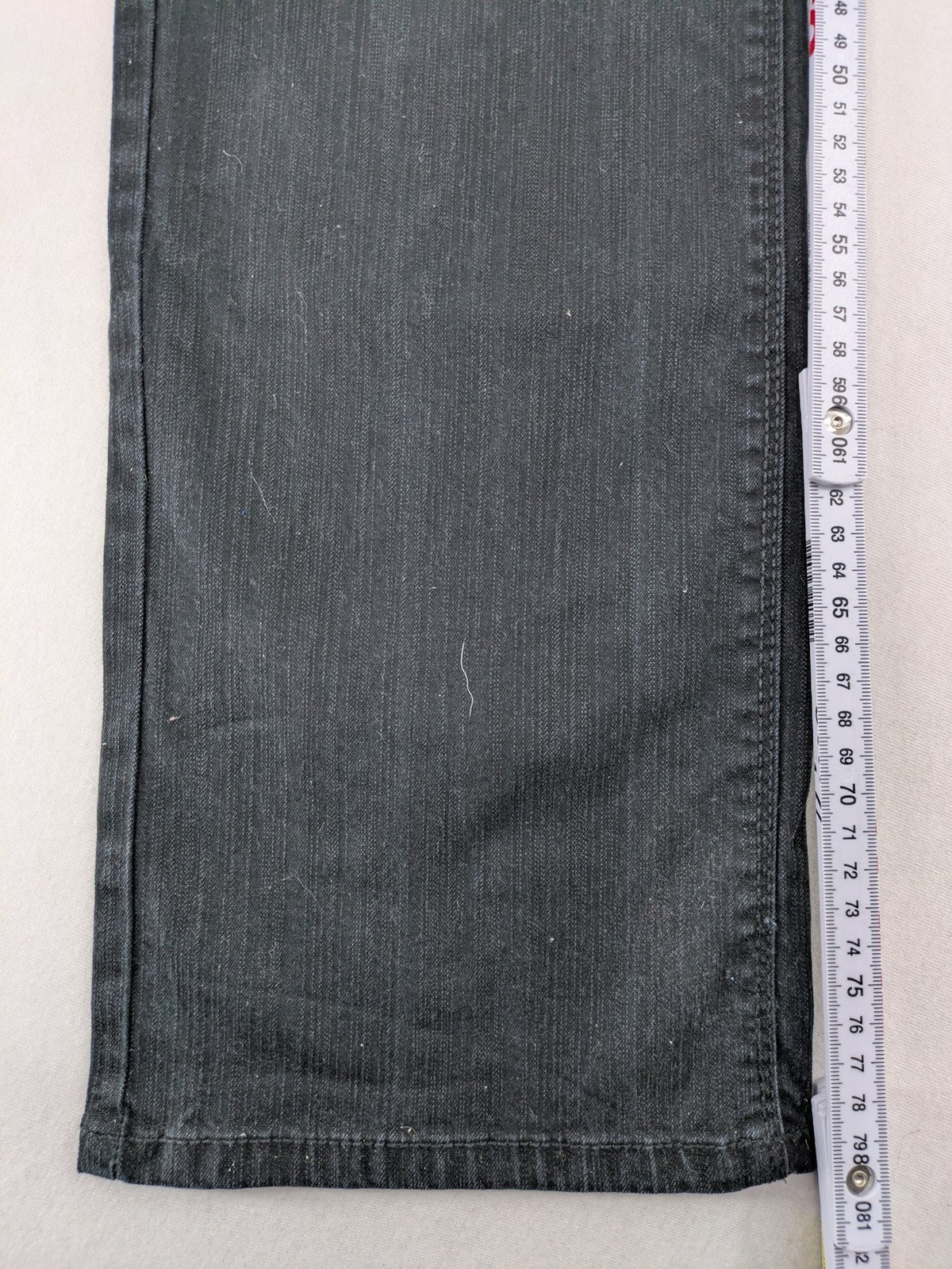 Yessica black straight jeans with classic dark wash and stretch denim material.
