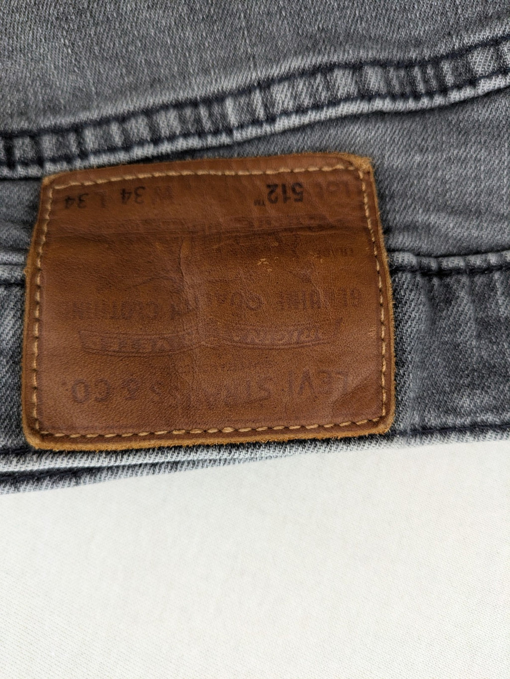 Levi's red straight jeans with classic 5-pocket design and slim taper fit.