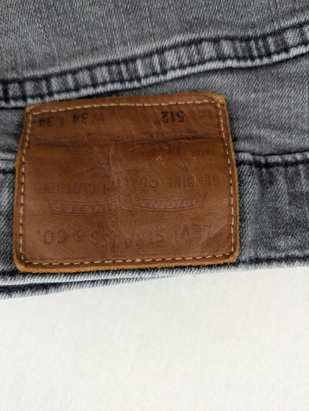Levi's red straight jeans with classic 5-pocket design and slim taper fit.