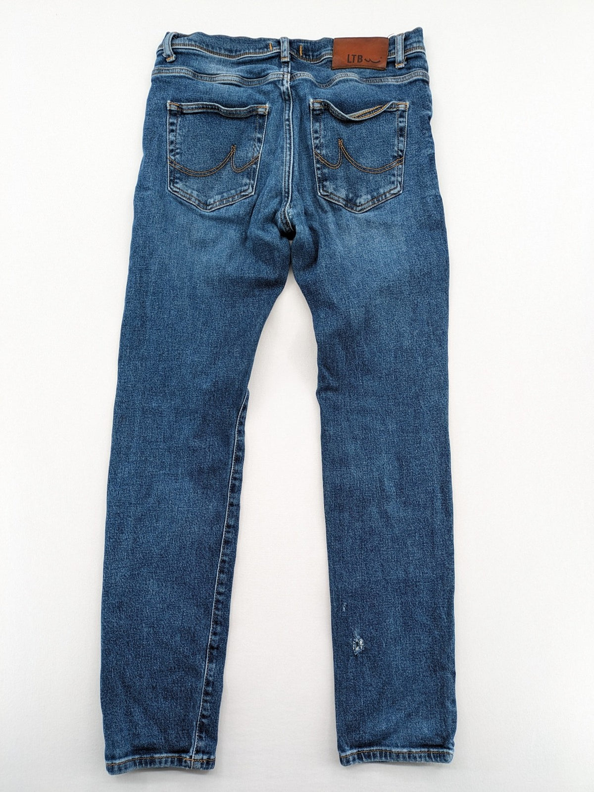 LTB blue straight jeans with low rise, button fly, and classic denim wash.