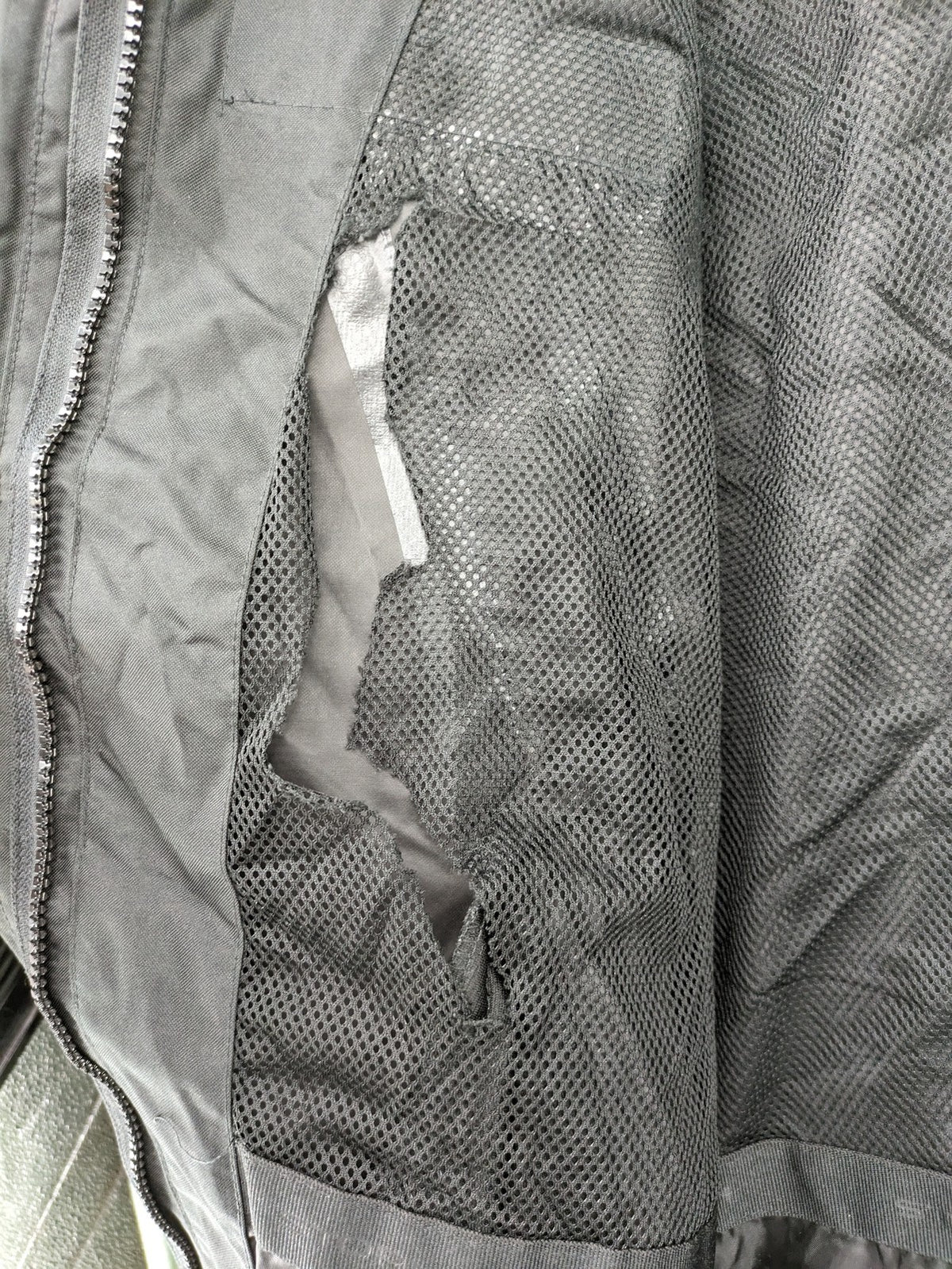 Stormtech black waterproof jacket with ZF logo, H2Xtreme technology, front zipper, and hood.