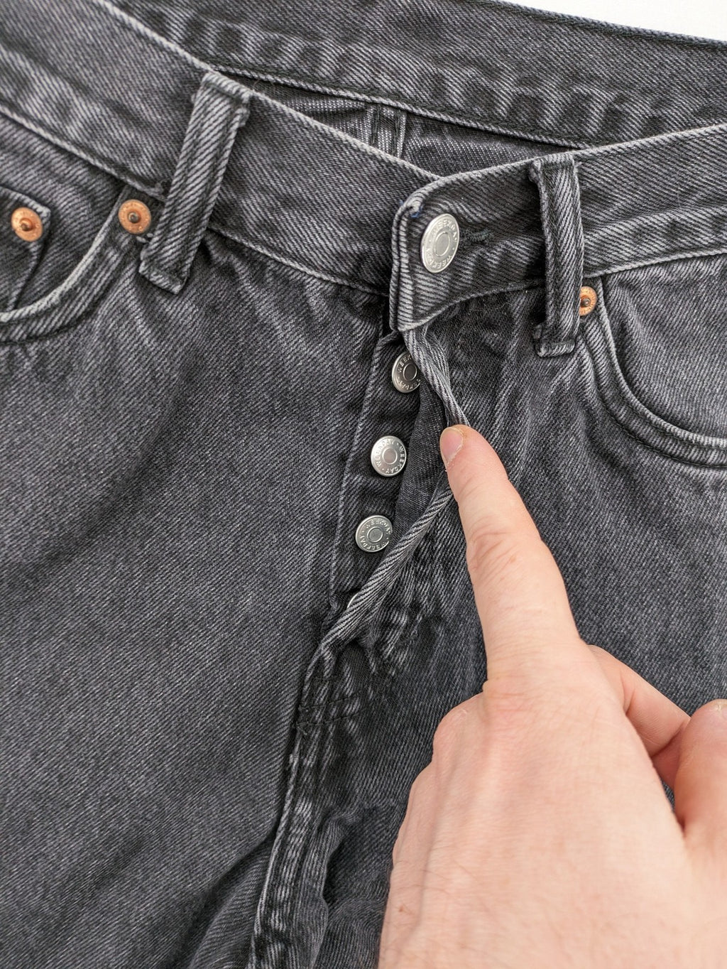Weekday grey straight jeans with button fly and classic denim design.