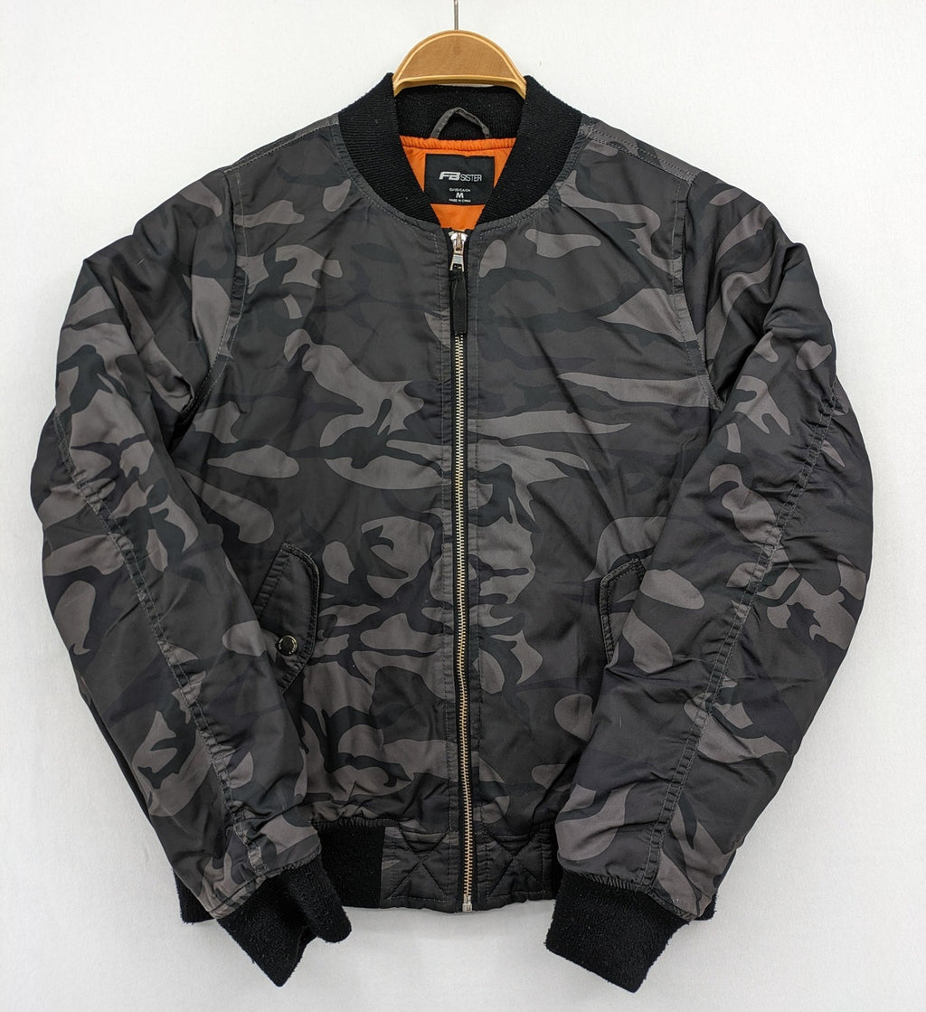 FB Sister orange bomber jacket with gray camouflage pattern and quilted lining.