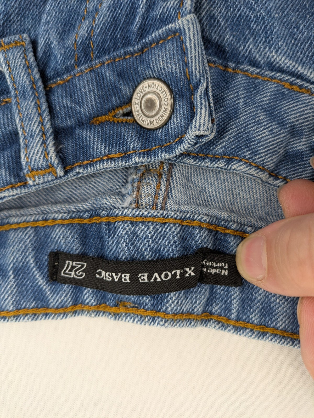 X.LOVE blue high waist wide leg jeans with front pleats and frayed hem.