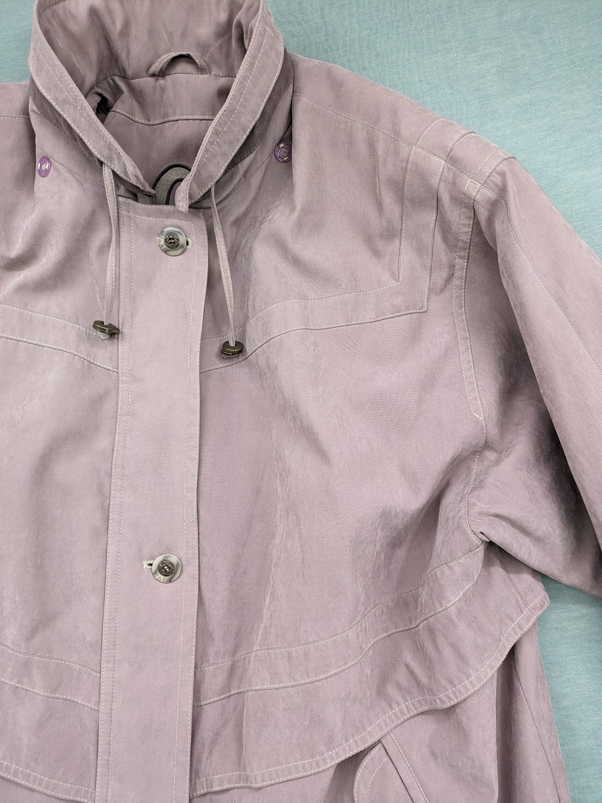 Goldix beige coat with checkered lining and Sympatex waterproof technology.