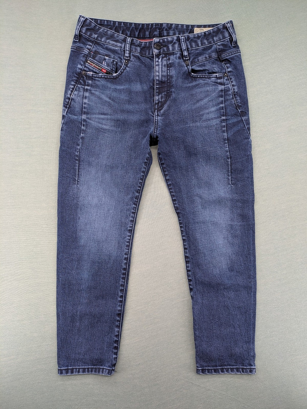 Diesel blue boyfriend jeans low waist dark wash stretch denim with logo patch.