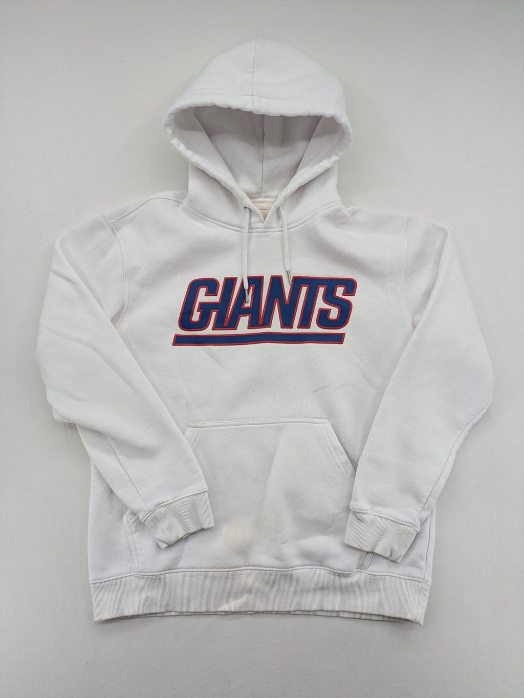 New York white hoodie with raised blue and red "GIANTS" logo and adjustable hood.