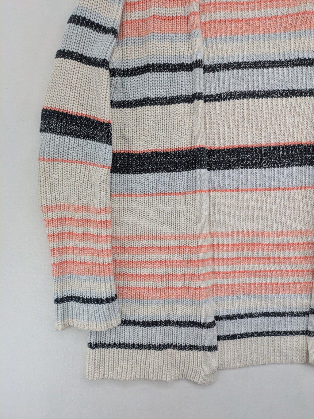Jonas multi turtle neck jumper with striped pattern and open front design.