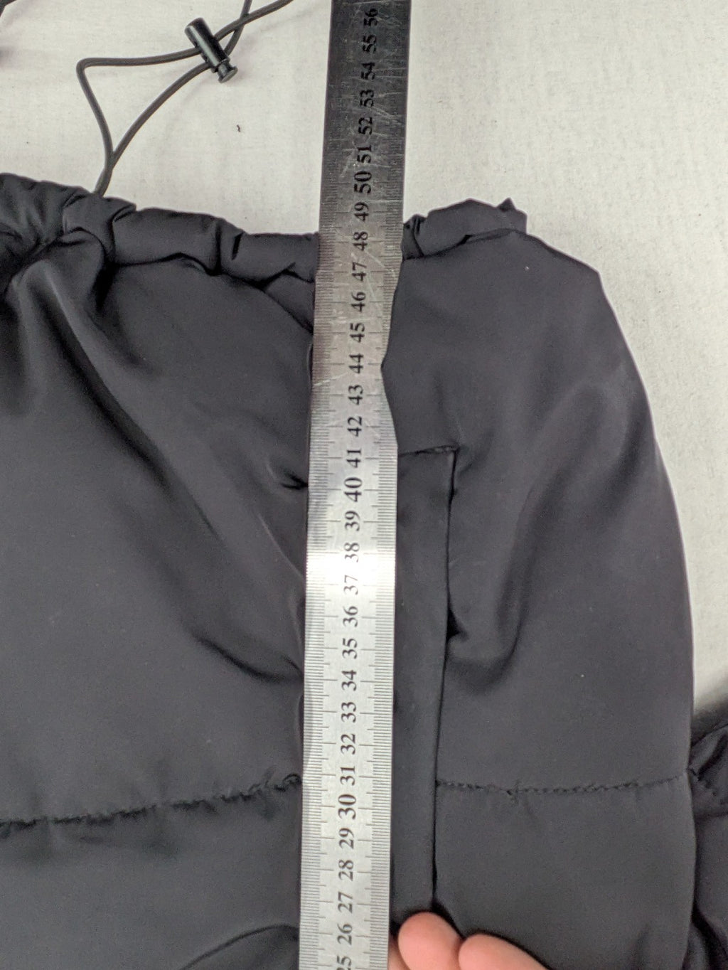 H&M Divided black cropped puffer jacket with zip closure and high collar.