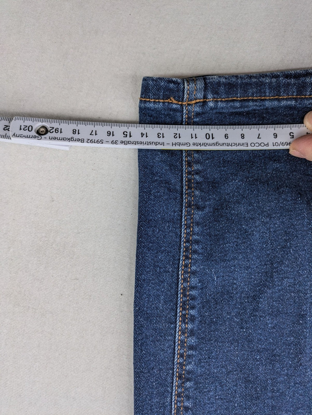 Denim & Co. blue skinny stretch jeans, five-pocket design, dark wash, durable material.