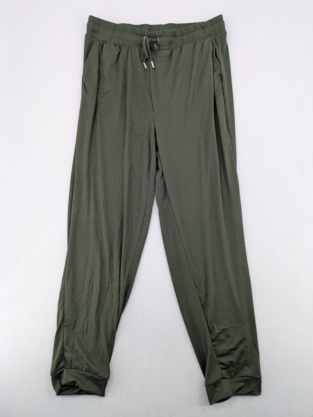 Infinity green jogger pants with elastic waistband and side pockets, soft stretch material.