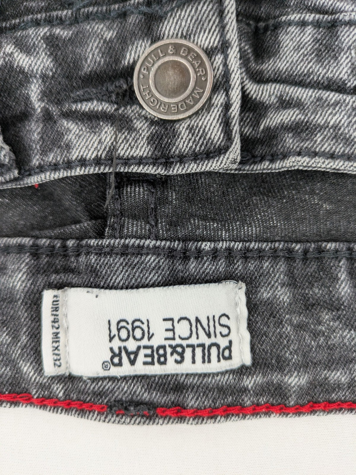 Pull&Bear black acid wash straight jeans slim fit with faded denim texture.