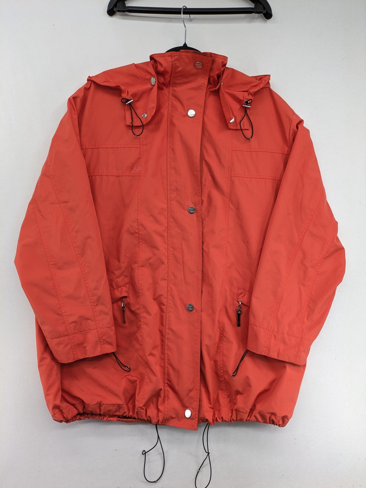 Sport Windbreaker orange jacket with adjustable hood, full zip, and button storm flap.