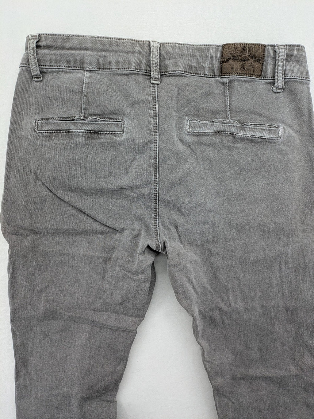 Made in Italy grey biker jeans with zip pockets and structured knee detailing.