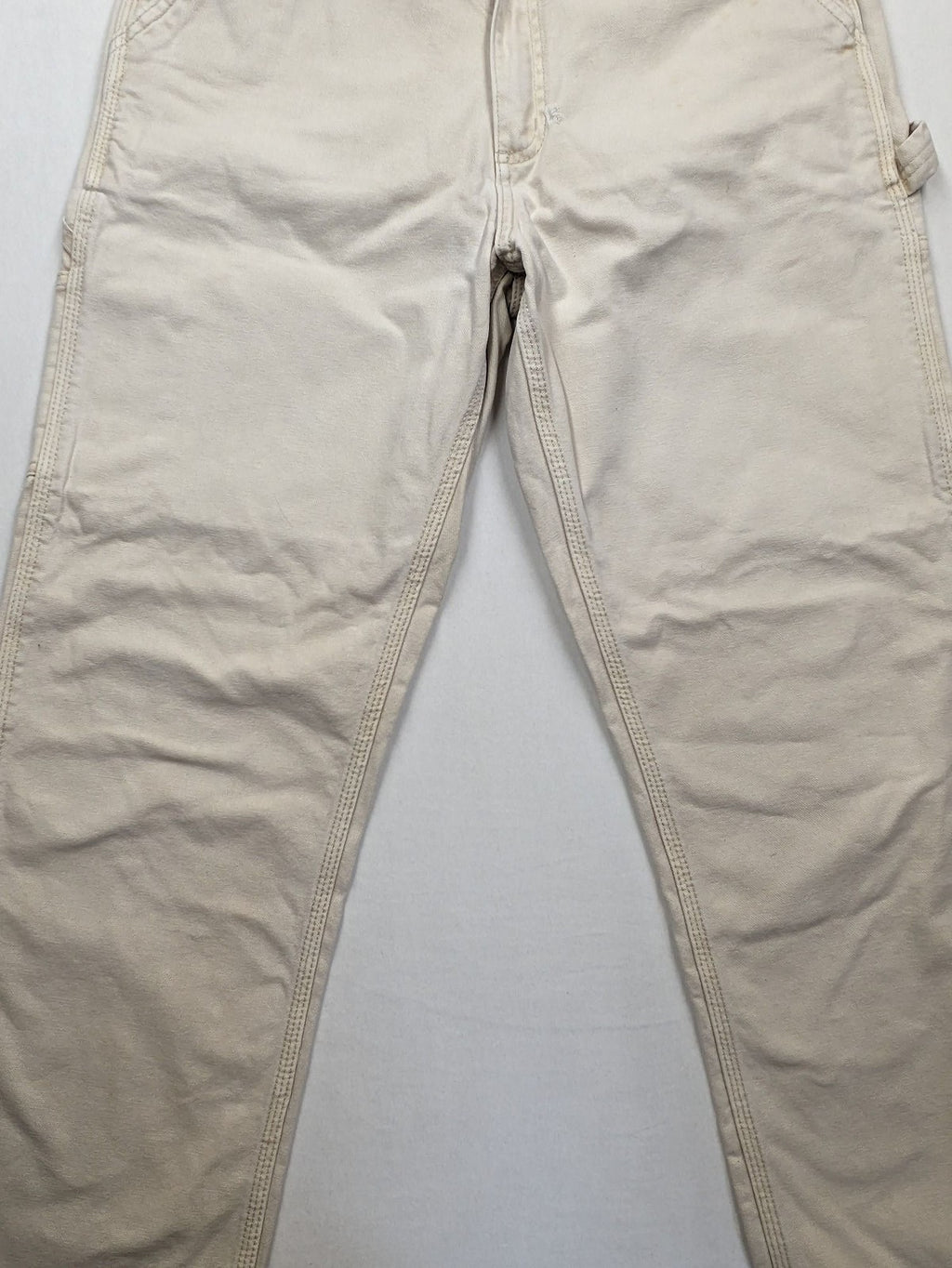 Pull&Bear beige carpenter pants with classic zipper, belt loops, and durable cotton material.