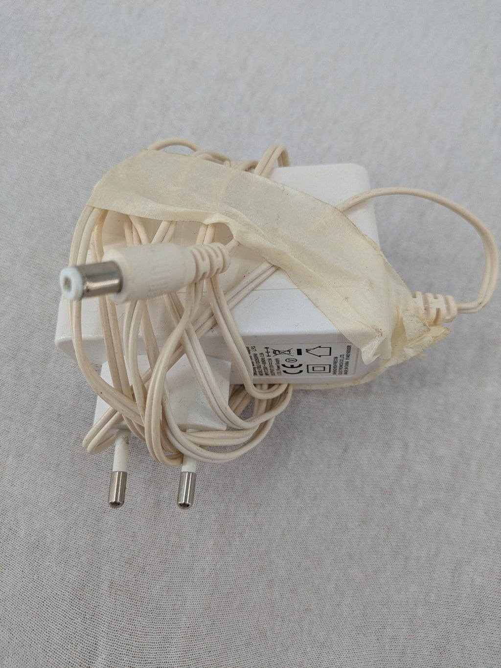 Compal beige WLAN modem router with integrated Wi-Fi and multiple LAN ports.