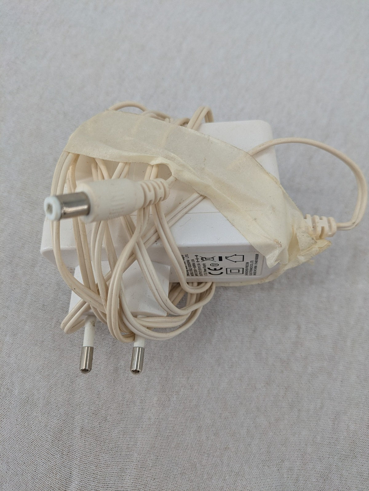Compal beige WLAN modem router with integrated Wi-Fi and multiple LAN ports.
