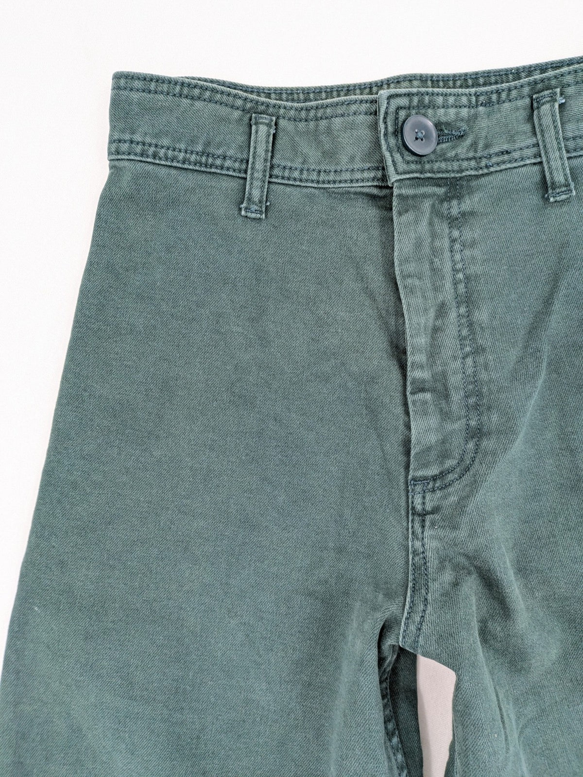 Zara green high waist wide leg jeans with frayed hem and button closure.