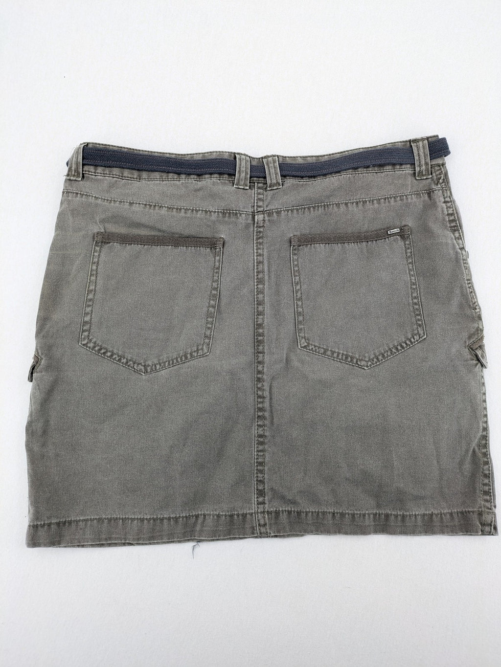 Bench khaki cargo mini skirt with belt, multiple pockets, and durable cotton material.