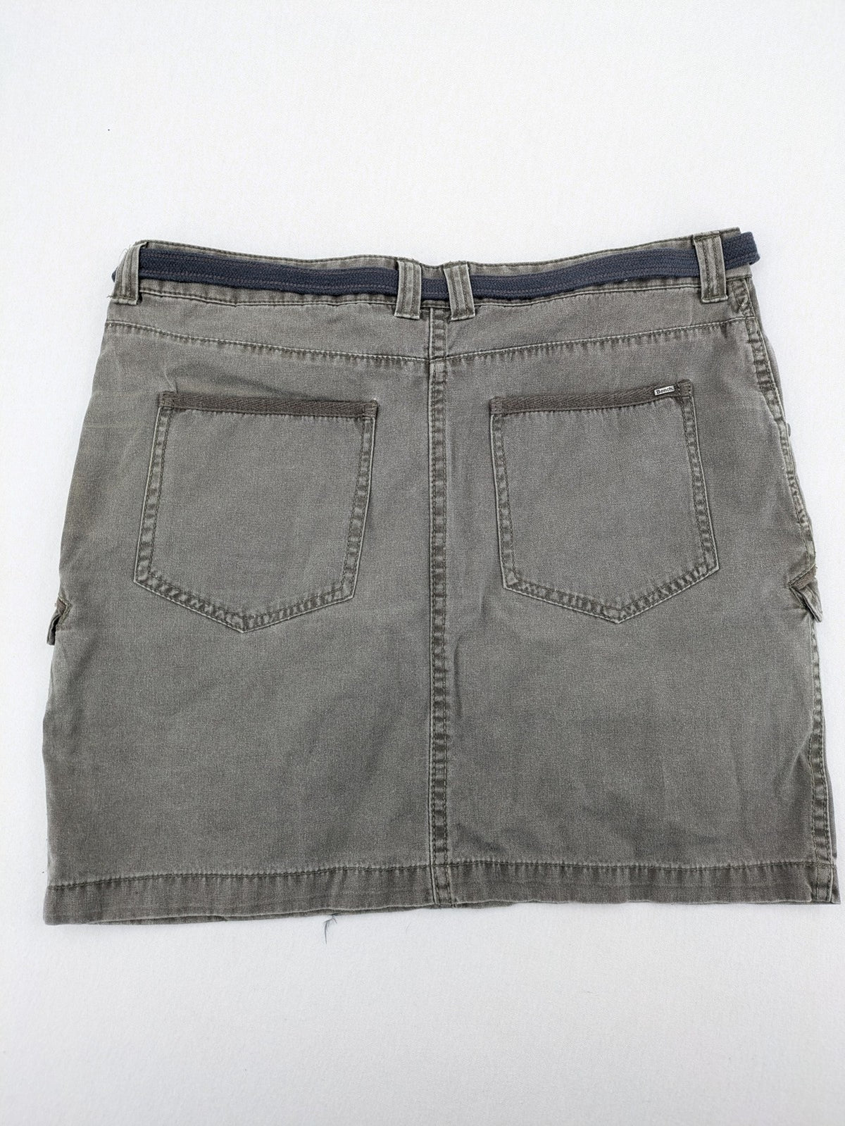 Bench khaki cargo mini skirt with belt, multiple pockets, and durable cotton material.