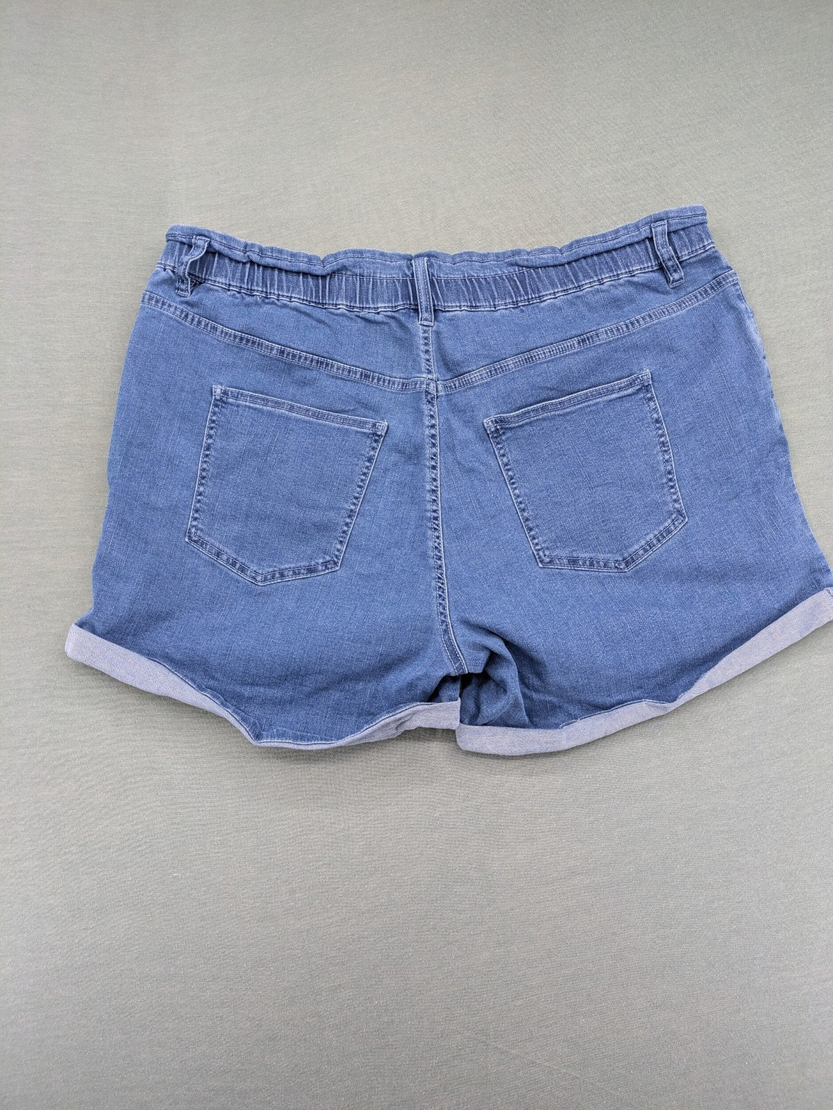 Bodyflirt blue high waist paperbag jeans shorts with button fly and rolled cuffs.