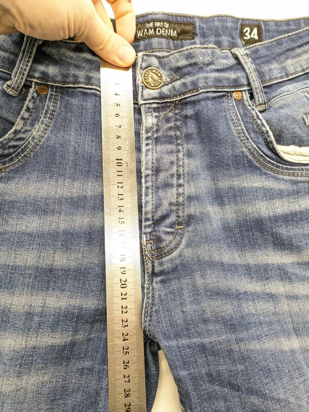 WAM Denim blue straight jeans with distressed details and button fly.