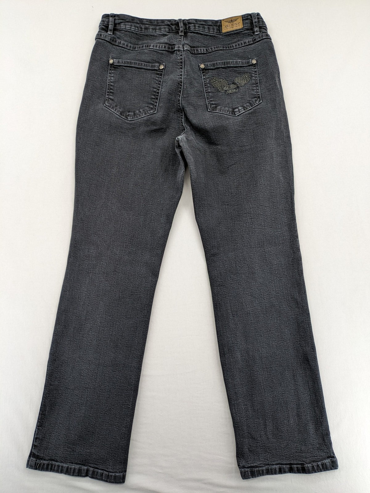 Arizona grey straight jeans with pearl-embellished wing appliqué on back pocket.
