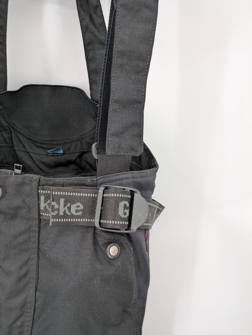 Hein Gericke black chaps with adjustable suspenders, made from durable Cordura and Kevlar.
