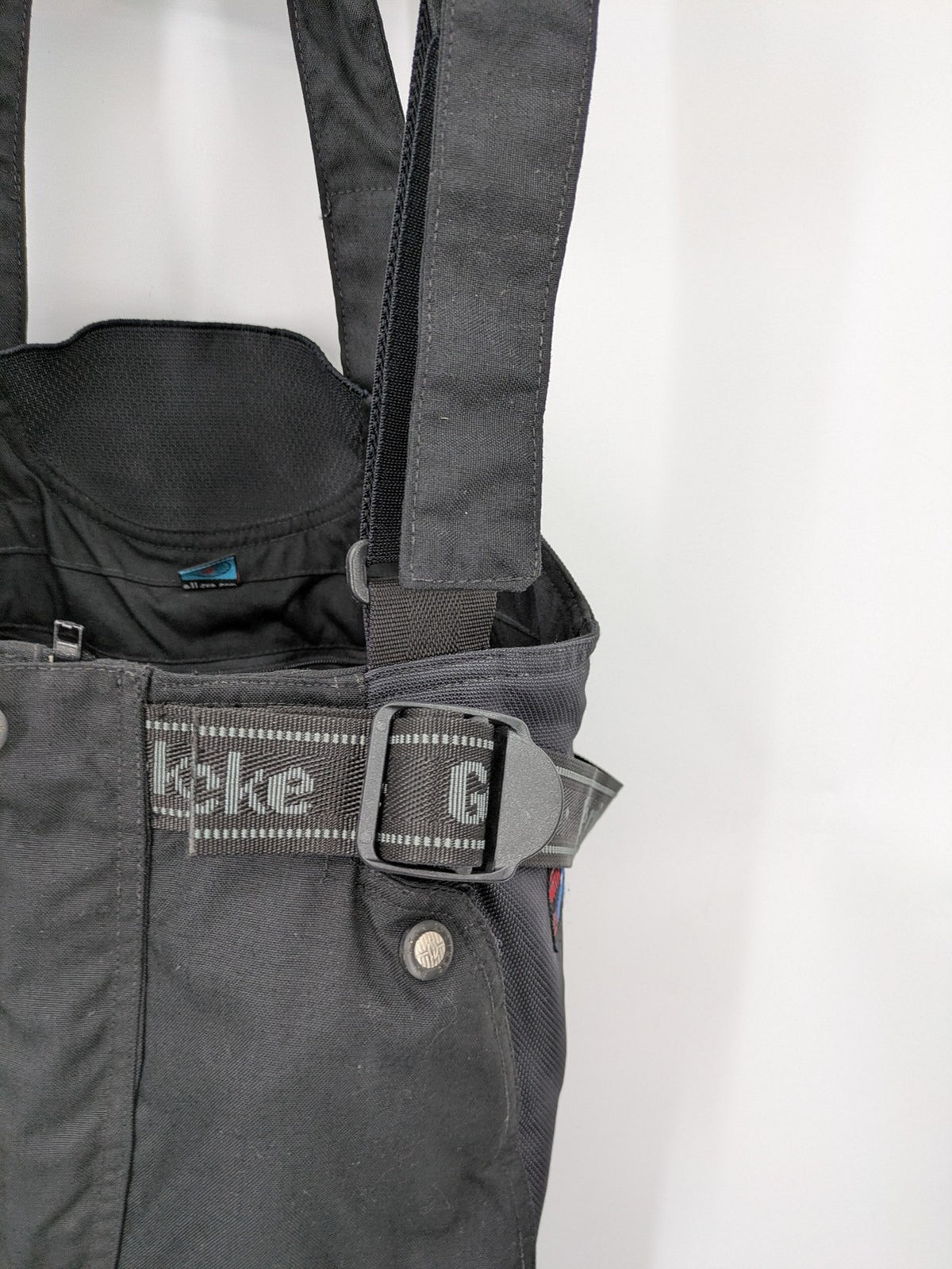 Hein Gericke black chaps with adjustable suspenders, made from durable Cordura and Kevlar.