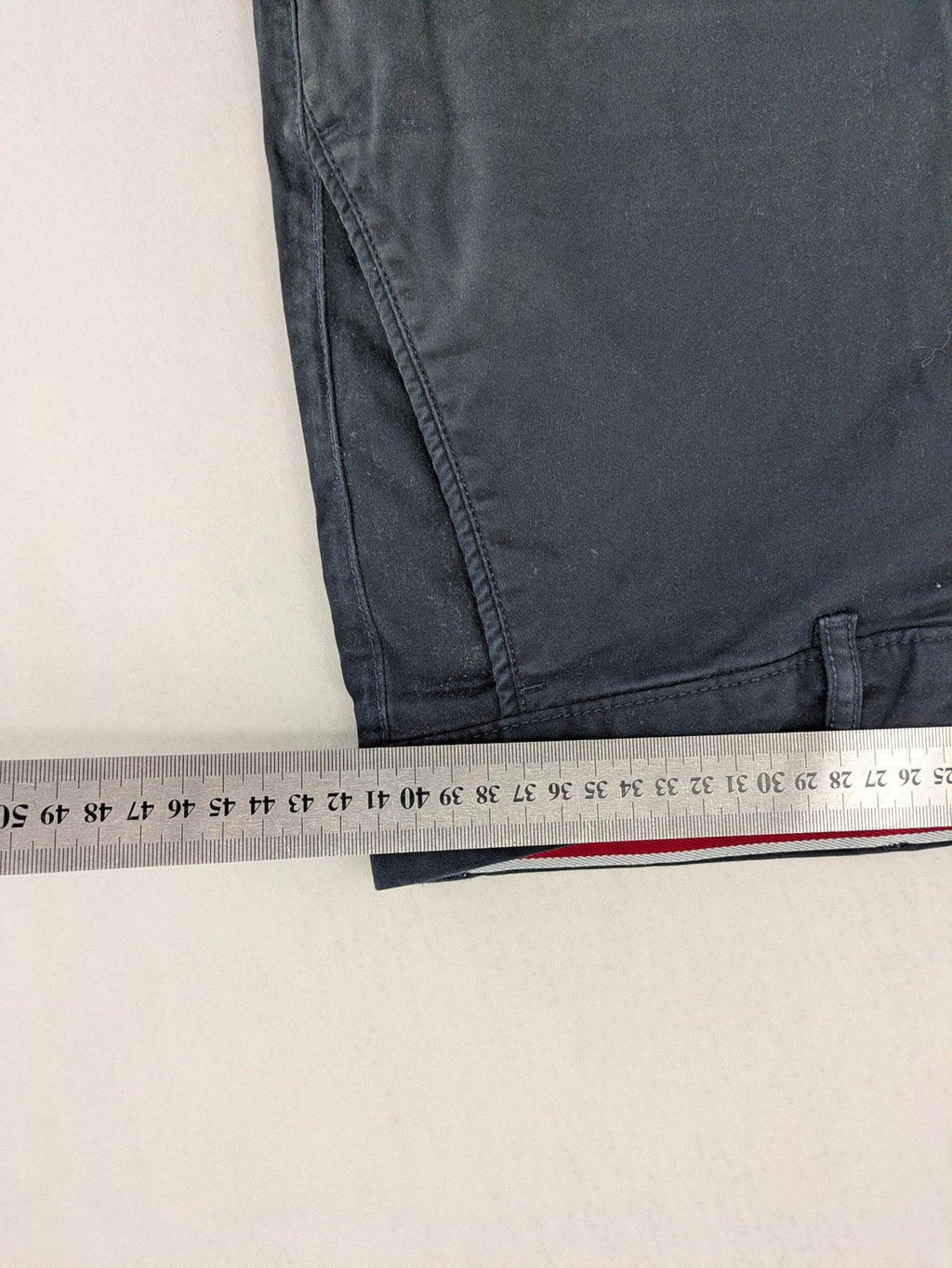 Tommy Hilfiger grey chino pants with TH-Flex stretch technology and classic straight fit design.