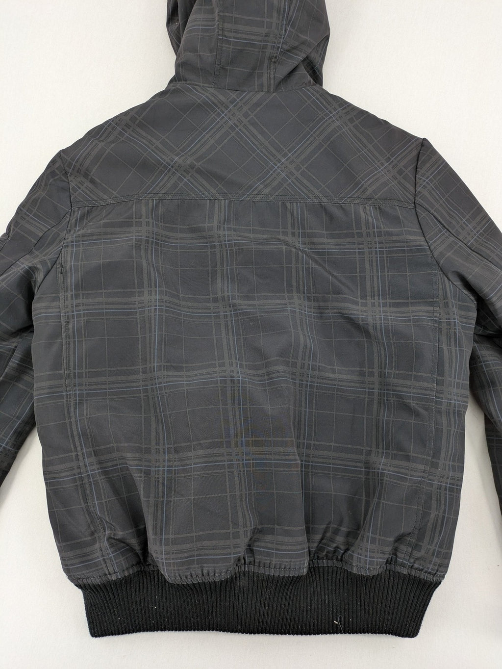 Jack & Jones grey checkered winter jacket with hood, quilted lining, and zip closure.