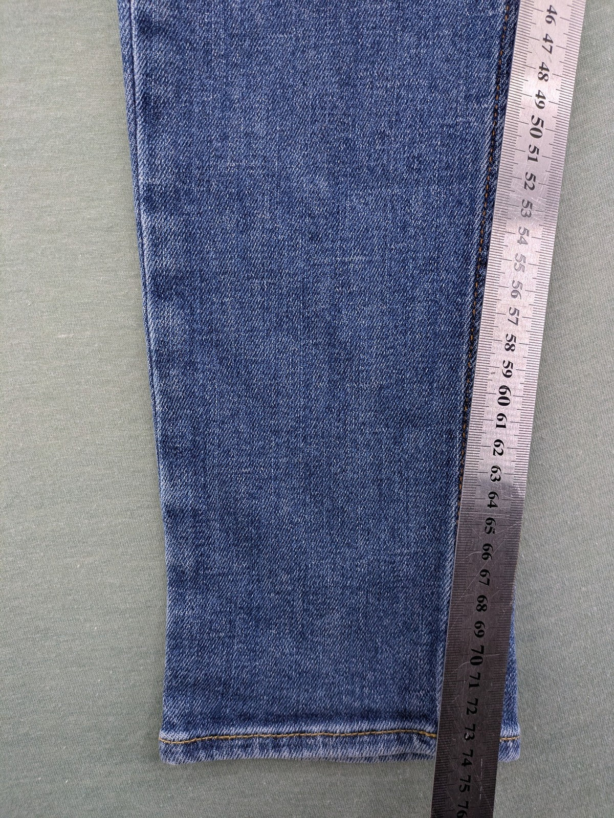Hollister blue slim fit jeans with classic 5-pocket design and stretch denim material.