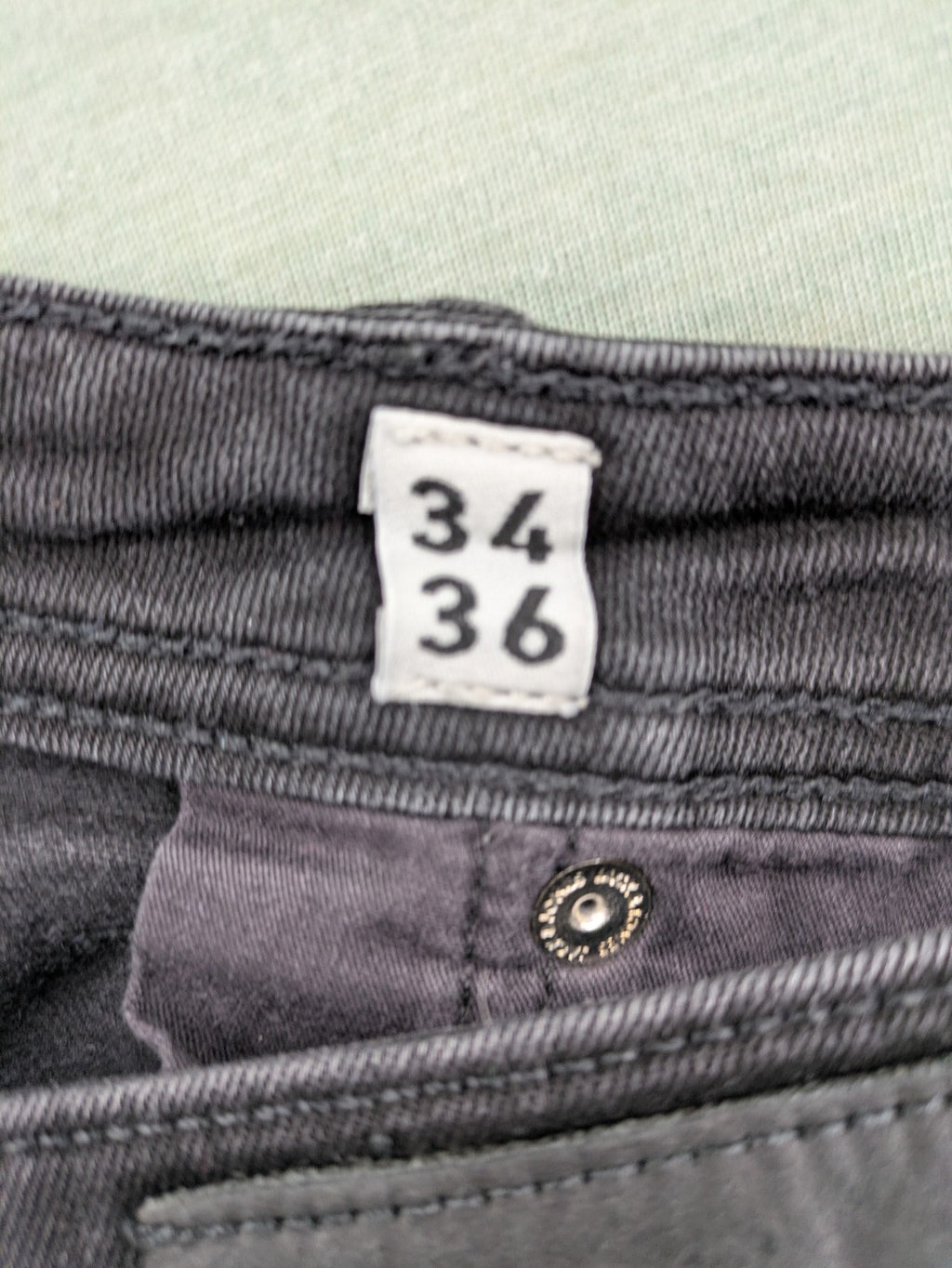 Jack & Jones black slim fit jeans faded wash stretch denim with logo detail.