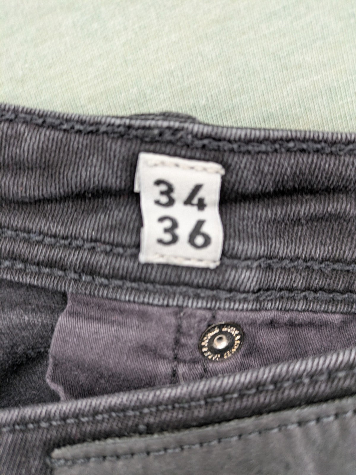 Jack & Jones black slim fit jeans faded wash stretch denim with logo detail.