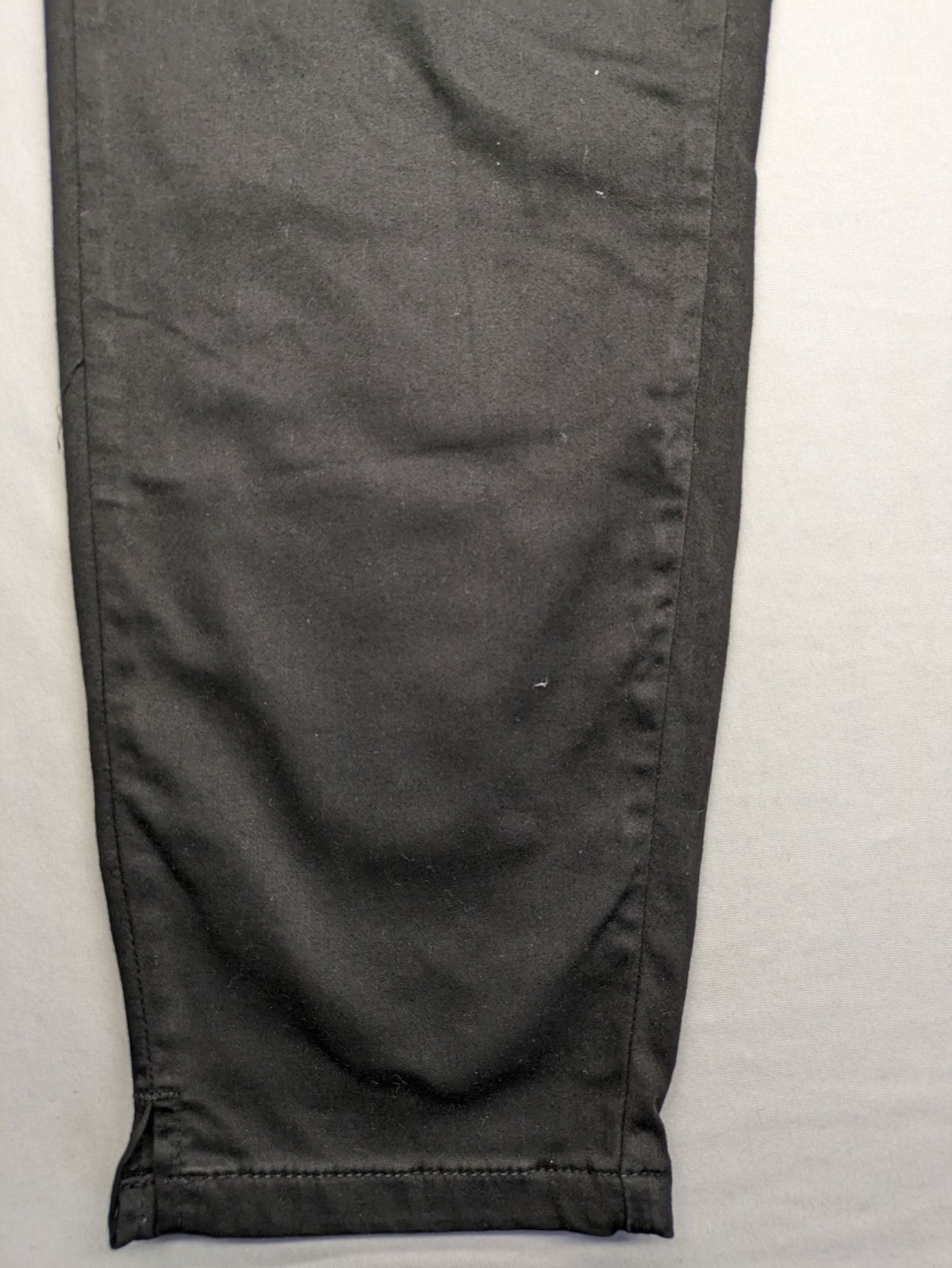 Colac black straight jeans high waist with double button, zipper pockets, and stretch material.