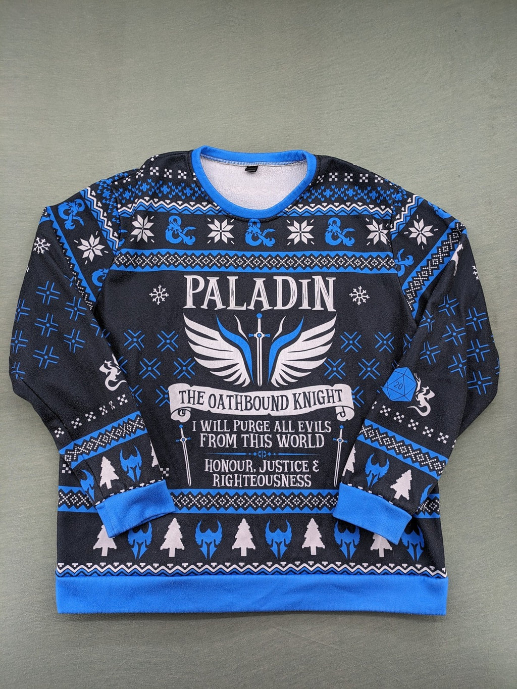 Dungeons & Dragons blue sweatshirt featuring Paladin text, iconic logo, and fantasy graphics.