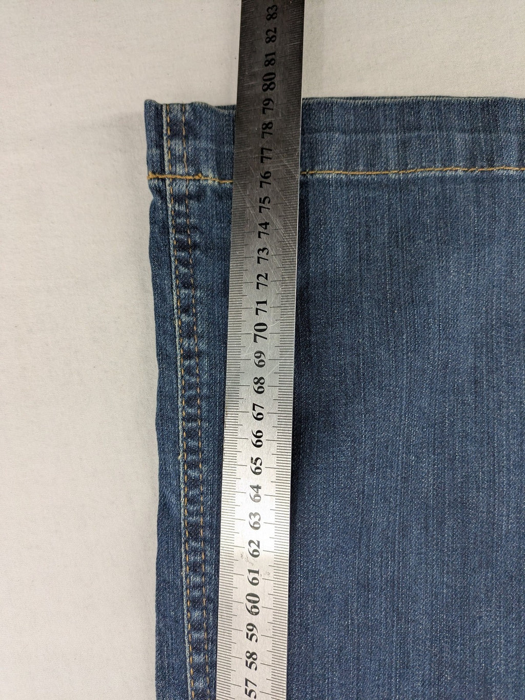Rosner blue wide leg jeans with colorful embroidery on back pockets.