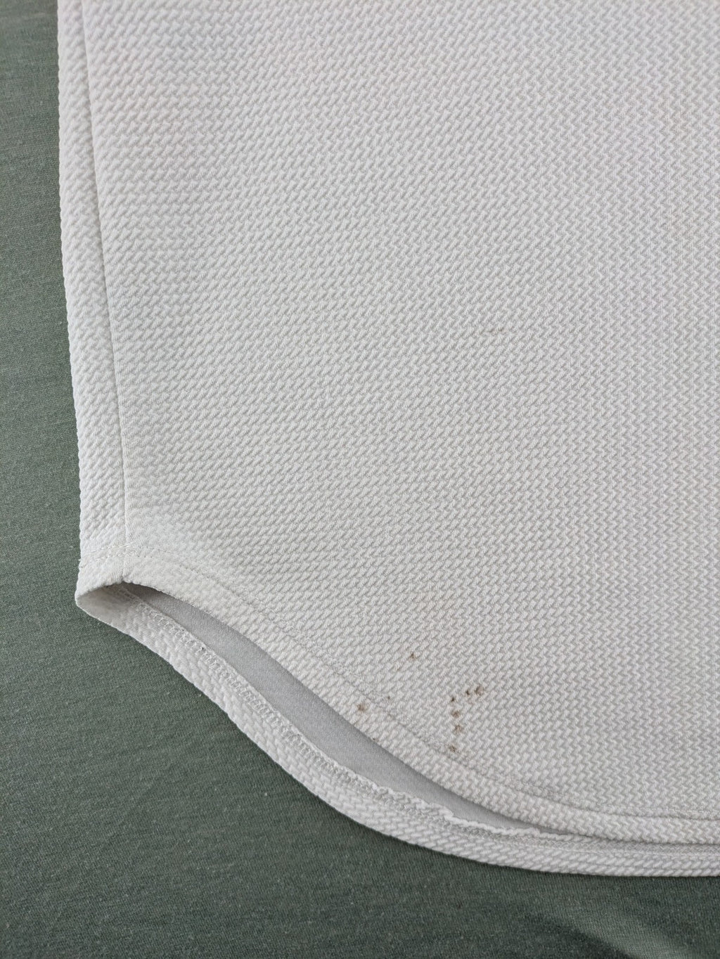 MIZ-U white longline t-shirt with "Street Angels" embroidery and rolled sleeves.