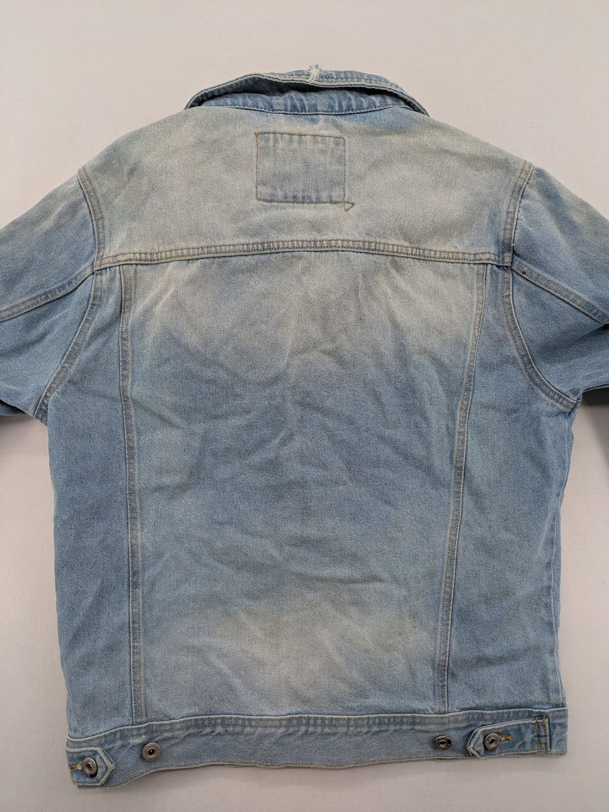 Zara Man blue denim jacket distressed with button closure and chest pockets.